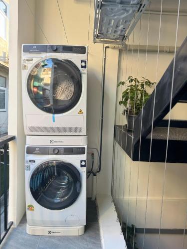 a washing machine and a washer in a trailer at Scandi Haus near ChinaTown in Bangkok
