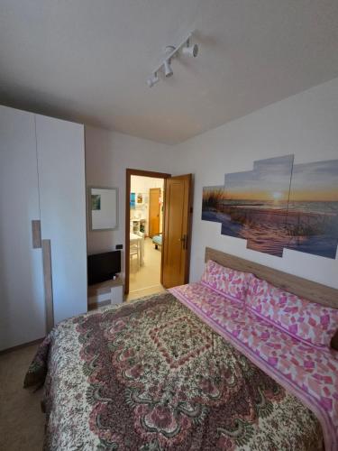 En eller flere senge i et værelse på Casa vacanze il tramonto vasto marina