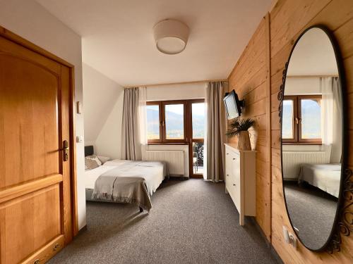 Ένα ή περισσότερα κρεβάτια σε δωμάτιο στο Dom na Wierchu