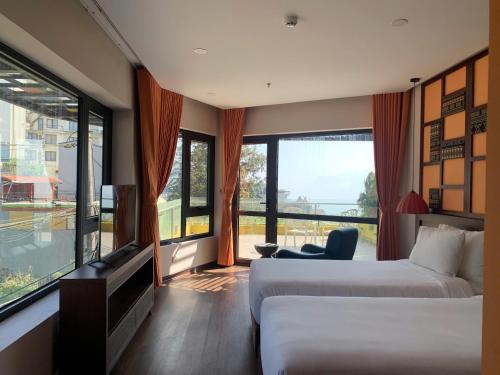 Ένα ή περισσότερα κρεβάτια σε δωμάτιο στο Lestar Hotel Sapa