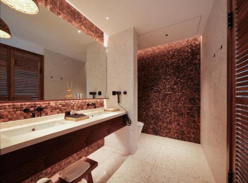 Ένα μπάνιο στο Jinghong Golan Garden Hotel in Xishuangbanna