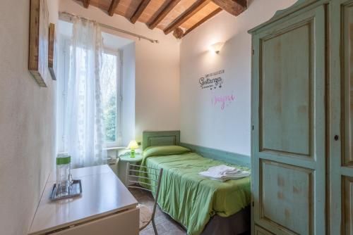 Ένα ή περισσότερα κρεβάτια σε δωμάτιο στο Podere La Miniera Room And Food