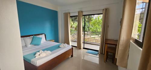 Ένα ή περισσότερα κρεβάτια σε δωμάτιο στο Lunazul Guesthouse