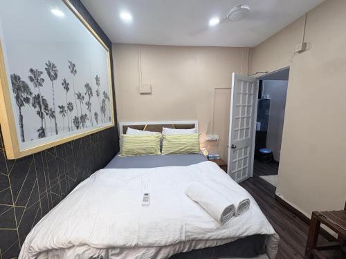a bedroom with a large bed in a room at 1BHK CASA BELLA Off Linking rd Ground floor in Mumbai