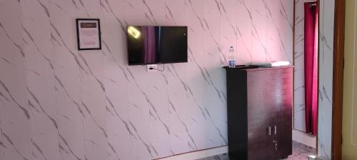 TV/trung tâm giải trí tại Yellow Divine Stay