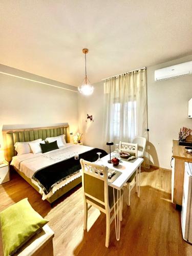 a bedroom with a bed and a table and a dining room at Angy's House in Verona