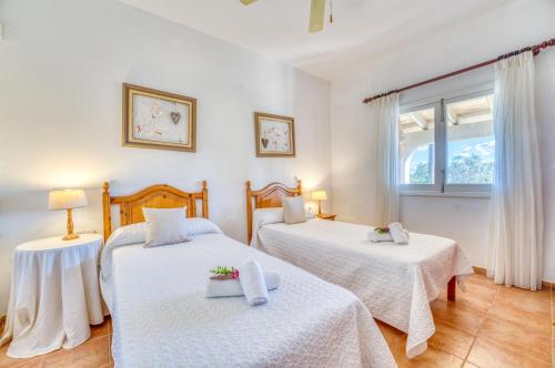 En eller flere senge i et værelse på Ideal Property Mallorca - Son Duri