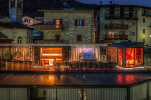 a building with a tent in front of it at Opinione Dimora Storica & Private Spa in San Lorenzo in Banale
