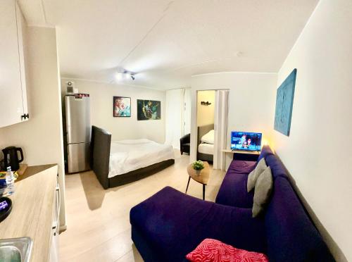 En eller flere senge i et værelse på Exclusive Smart Home Central Oslo