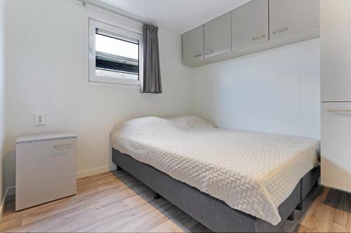 Ένα ή περισσότερα κρεβάτια σε δωμάτιο στο Chalet Pareloester - Ouddorp