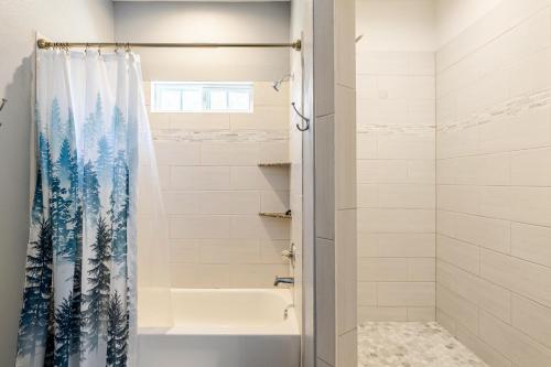 a bathroom with a tub and a shower curtain at Welcome to enjoy your home in Dallas