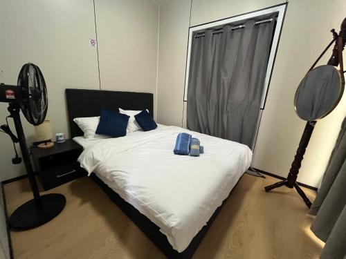 En eller flere senge i et værelse på Grace Mt Kinabalu Pods