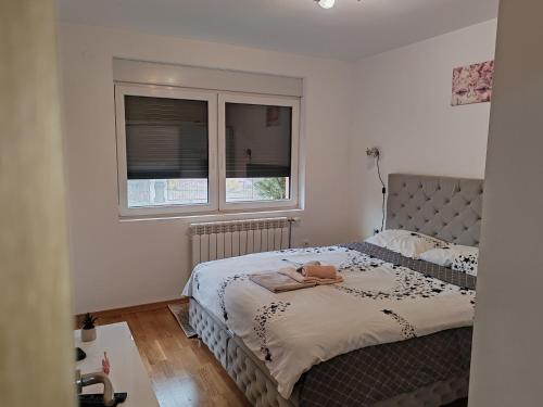 Postel nebo postele na pokoji v ubytování Apartmani Lucky Place