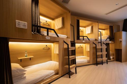 Giường trong phòng chung tại Qingdao Desti Youth Hostel