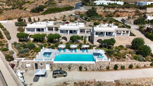 an aerial view of a villa with a swimming pool at Kriolithos Houses in Parikia