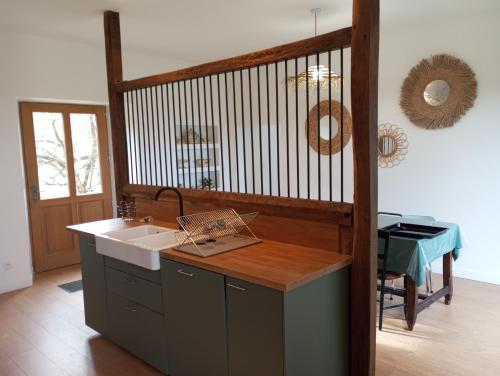 a kitchen with a sink and a counter top at Maison de maître in Bernac-Debat