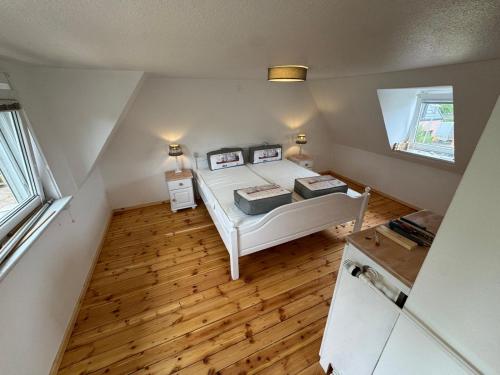 a small bedroom with a bed and a window at Möwennest in Timmendorfer Strand