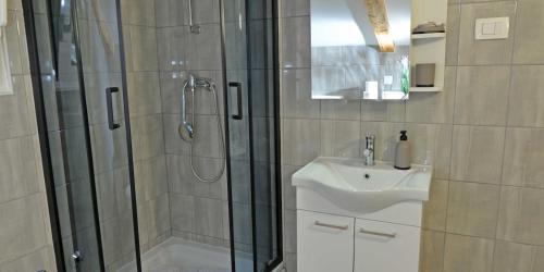a bathroom with a shower and a sink at Antunovic in Veli Lošinj