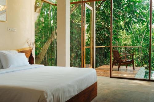 Ένα ή περισσότερα κρεβάτια σε δωμάτιο στο vrihee resort