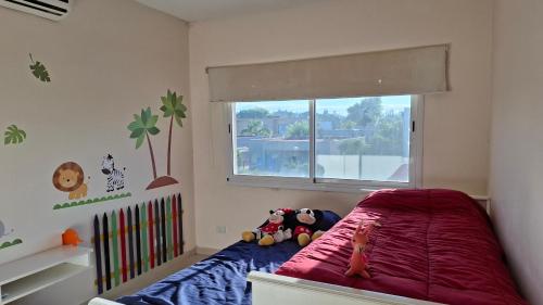 Ένα ή περισσότερα κρεβάτια σε δωμάτιο στο Casa con Pileta Los Arces Pilar