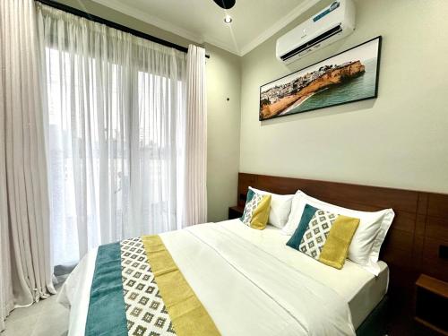 Ένα ή περισσότερα κρεβάτια σε δωμάτιο στο 2BDRM Apartment - Mbezi Beach