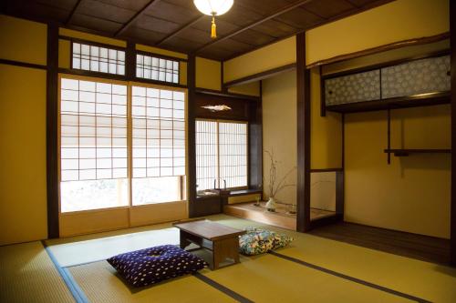 Postel nebo postele na pokoji v ubytování Ryokan Mugen (Adult Only)