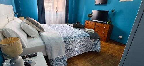 Ένα ή περισσότερα κρεβάτια σε δωμάτιο στο Piso amplio y luminoso, La Pomar