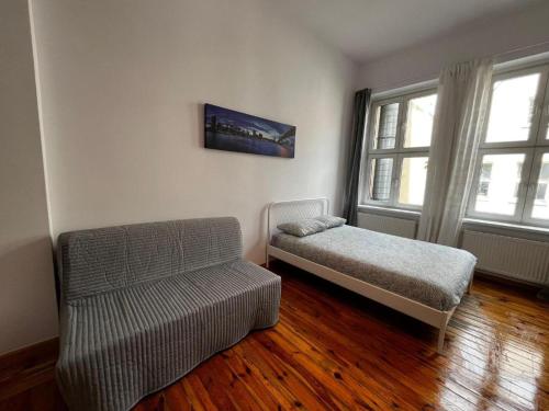 Ένα ή περισσότερα κρεβάτια σε δωμάτιο στο the POZNAN SPOT