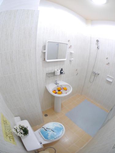a bathroom with a sink and a toilet and a shower at Adams house in Patong Beach