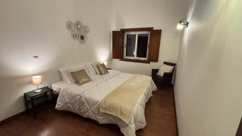 Ένα ή περισσότερα κρεβάτια σε δωμάτιο στο Pouso Du'Vagar