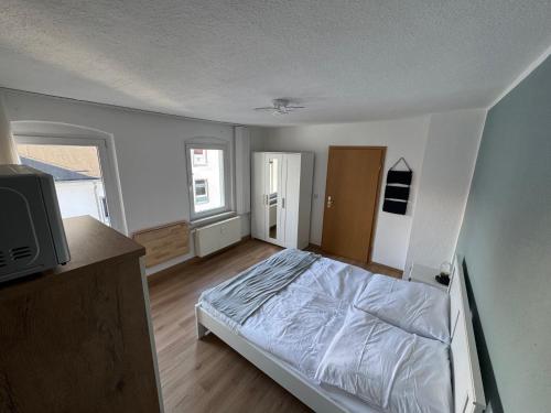 Ένα ή περισσότερα κρεβάτια σε δωμάτιο στο Ferienwohnung Steinstübchen