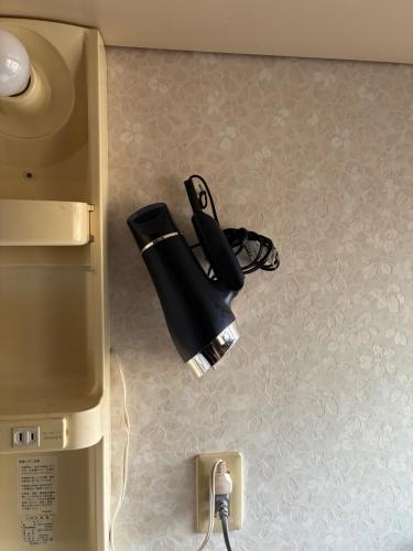 a black light on the floor next to a refrigerator at Refugio del Café - Vacation STAY 92035v in Iwaki