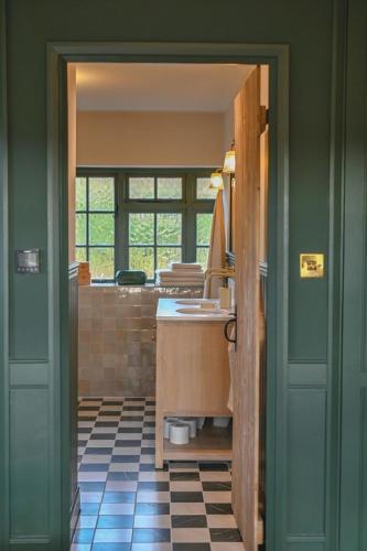 a bathroom with a sink and a counter in a room at Merryweather in Canterbury