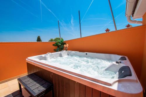a large bath tub sitting on top of a building at Vila Andja in Banjole,Istrien by Istrabook in Banjole