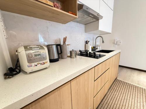 Η κουζίνα ή μικρή κουζίνα στο Singgahsini Guesthouse Putrajaya