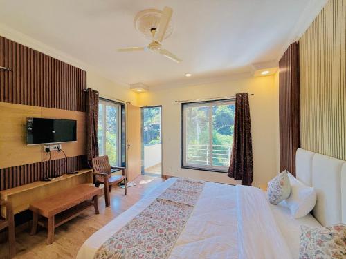 Ένα ή περισσότερα κρεβάτια σε δωμάτιο στο Green Valley Resort