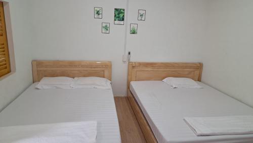 Ένα ή περισσότερα κρεβάτια σε δωμάτιο στο đất phú homestay phú yên