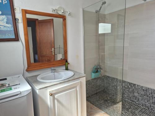 a bathroom with a sink and a shower at Sabbia Suites Casa Vera in Teguise