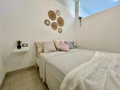 Un pat sau paturi într-o cameră la La Corte di Crenna