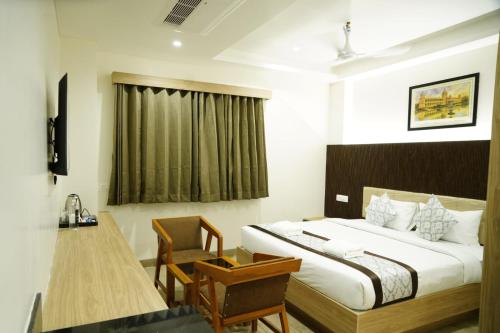 Ένα ή περισσότερα κρεβάτια σε δωμάτιο στο V1-One Bouteeque Hotel