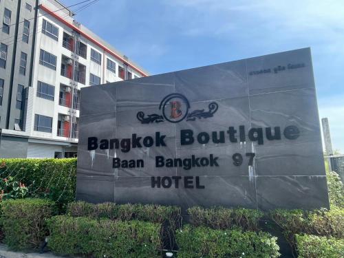 a sign for a hotel in front of a building at Bangkok Boutique Resort Rangsit in Pathum Thani