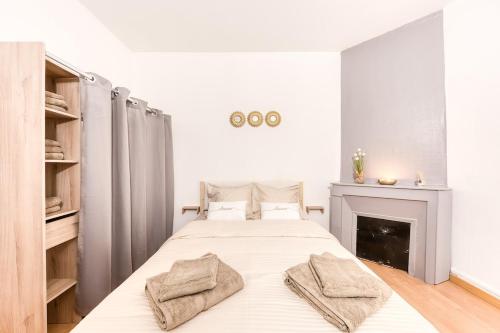 Ένα ή περισσότερα κρεβάτια σε δωμάτιο στο Charmant T3 en bord de marne, centre ville proche Disneyland & Paris