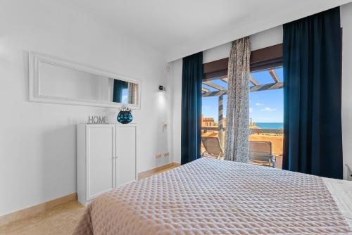 En eller flere senge i et værelse på Ático de lujo con vistas al mar