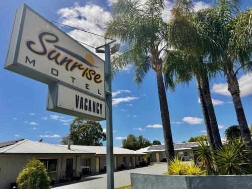 a sign in front of a motel at Sunrise Motel in Barooga