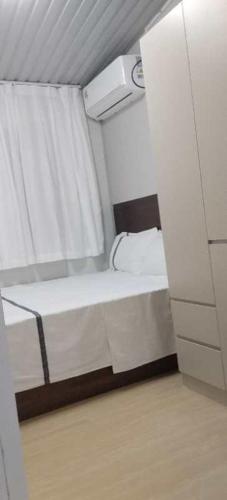 a small room with a bed and a window at Nadi friendly Apartment --2 bedroom in Nadi