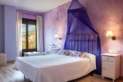 Ένα ή περισσότερα κρεβάτια σε δωμάτιο στο Sierra Quilama