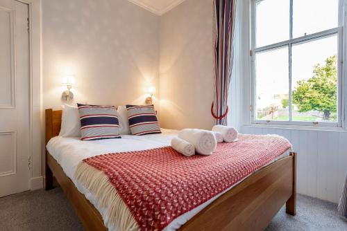 Ένα ή περισσότερα κρεβάτια σε δωμάτιο στο Norloch Cottage - Elie