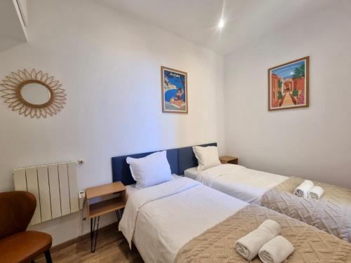 Ένα ή περισσότερα κρεβάτια σε δωμάτιο στο Jules Ferry Monaco