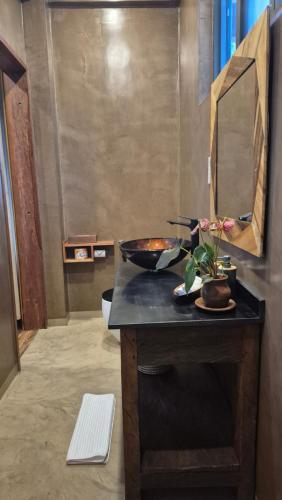 a bathroom with a sink and a mirror on a counter at Explorers Kilimanjaro Boutique Hotel in Moshi