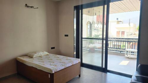 En eller flere senge i et værelse på Namoha Stay-Villa